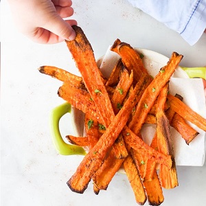 roasted carrot strips hand