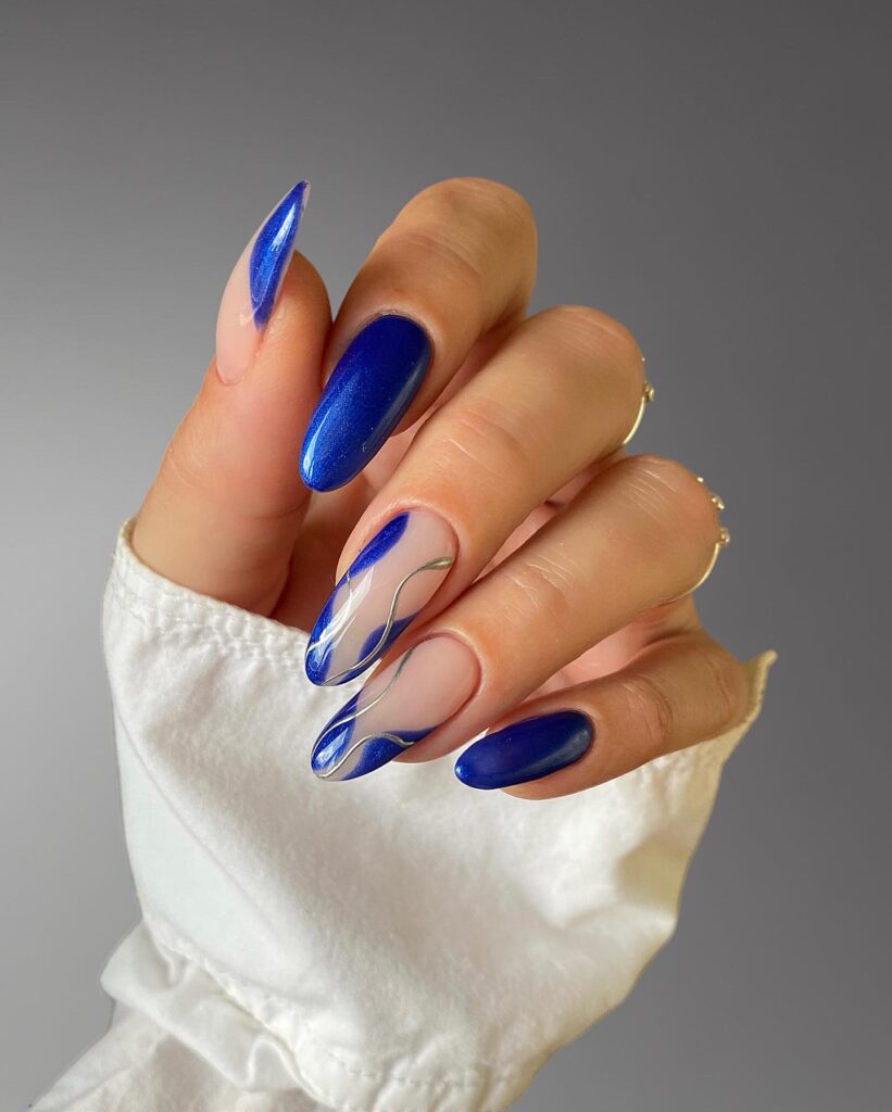 Assorted blue nails designs featuring light blue nails, royal blue acrylic nails, and blue french tip nails on various hand poses.