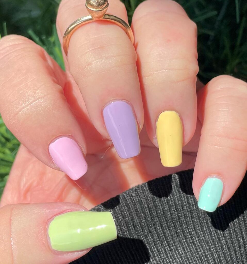 A collection of pastel nails in shades of pastel pink, pastel blue, and pastel green, showcasing spring pastel nails and cute nail designs