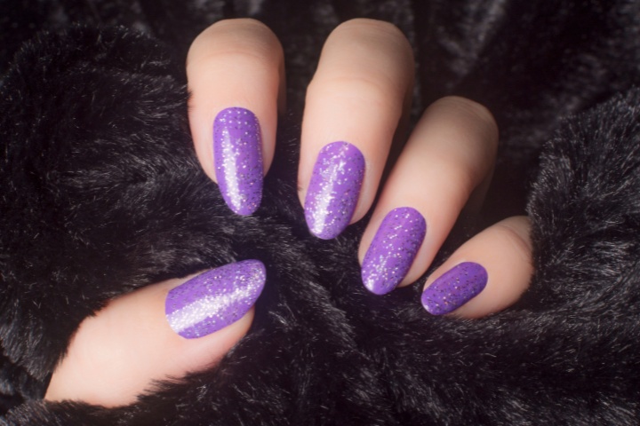 A stunning collection of purple nails in various shades from light purple to dark purple, showcasing elegant designs and polishes.