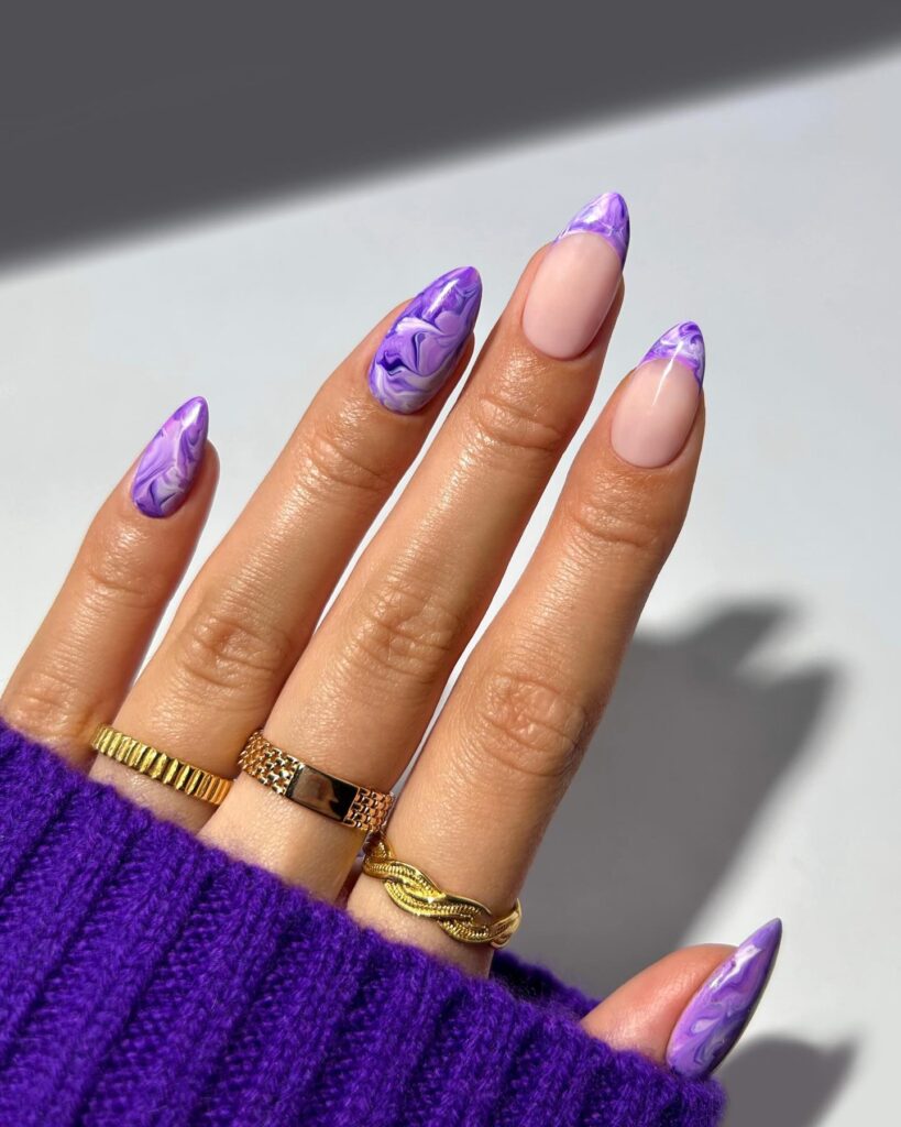 A stunning collection of purple nails in various shades from light purple to dark purple, showcasing elegant designs and polishes.