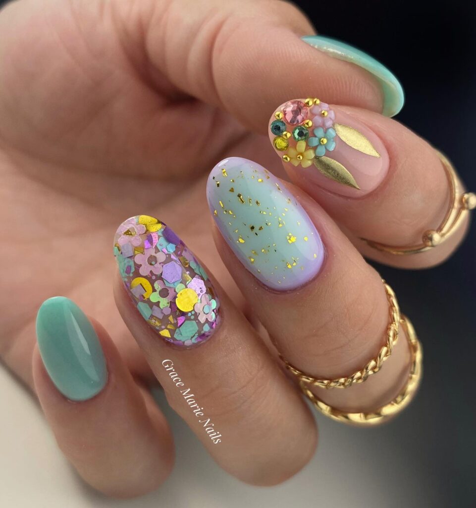 Bright spring acrylic nails with pastel colors and floral designs perfect for spring break.
