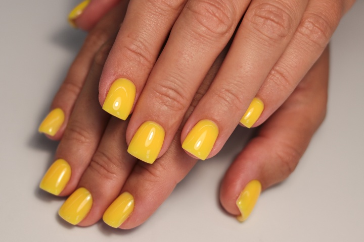 A vibrant display of yellow nails with a mix of neon yellow, yellow french nails, and yellow nail designs for summer.