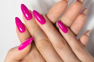 Variety of summer pink nail polishes and designs, including hot pink, neon, and light pink shades, perfect for trendy summer manicures.