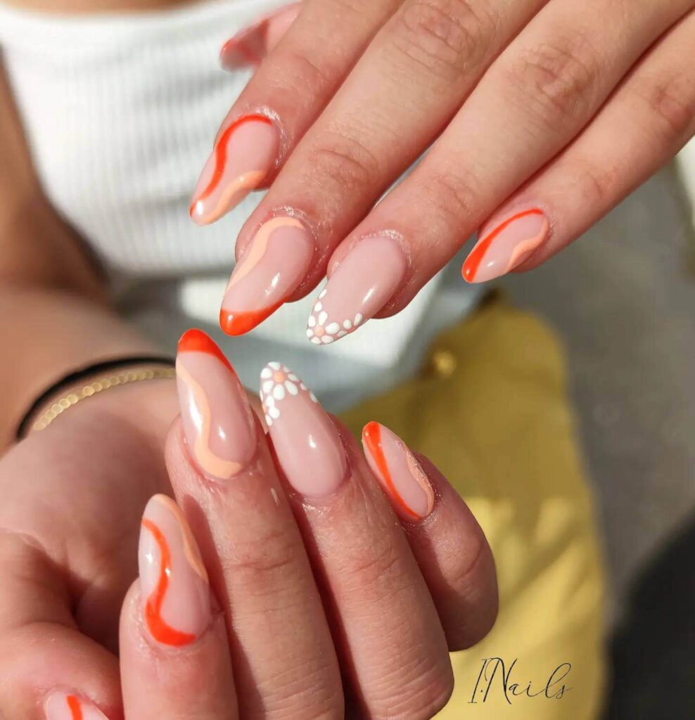 trendy summer nails with a range of orange shades including neon, burnt, and glitter finishes, ideal for seasonal flair.