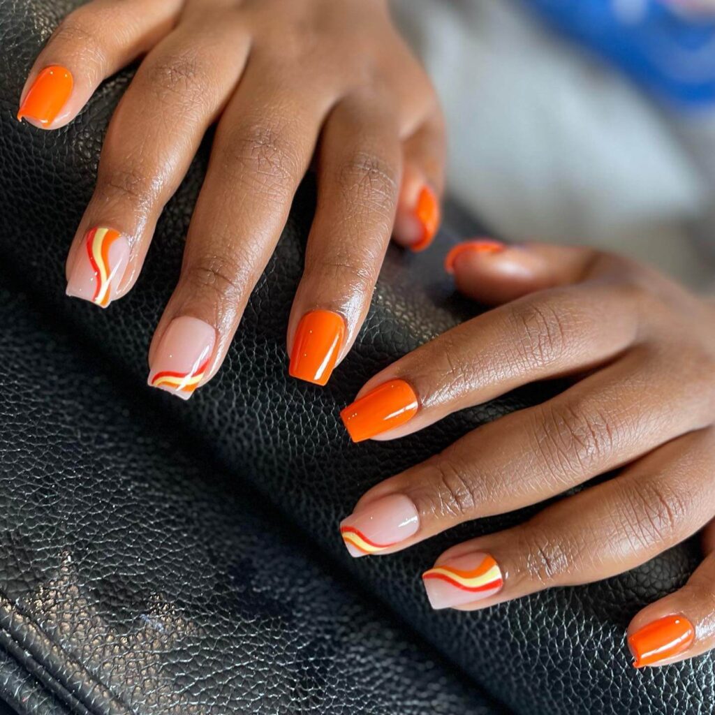 trendy summer nails with a range of orange shades including neon, burnt, and glitter finishes, ideal for seasonal flair.