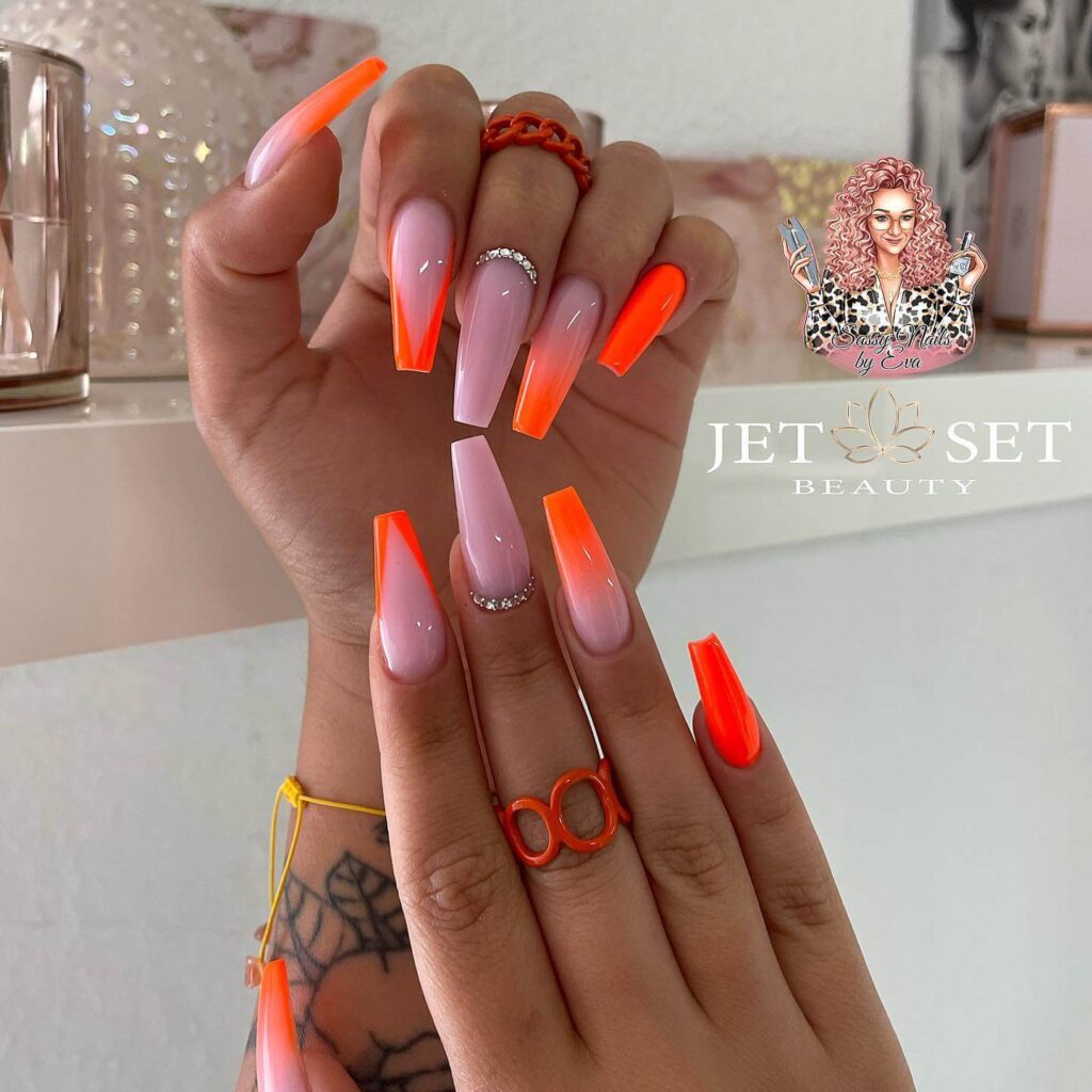 trendy summer nails with a range of orange shades including neon, burnt, and glitter finishes, ideal for seasonal flair.