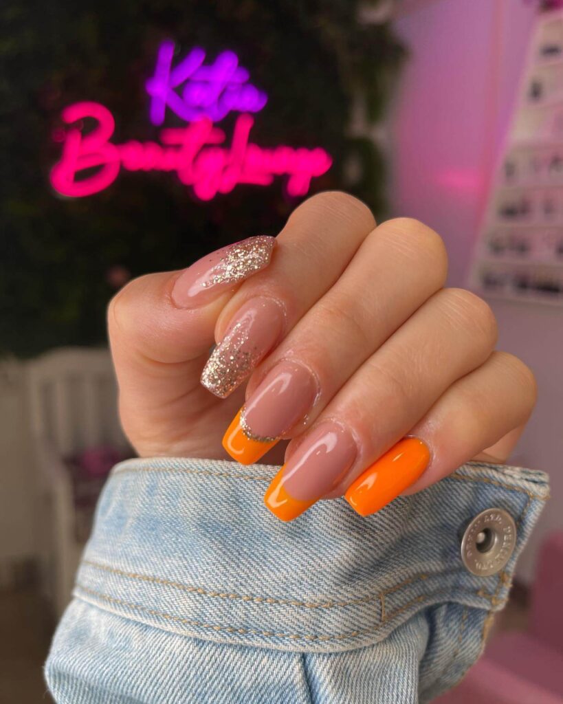 trendy summer nails with a range of orange shades including neon, burnt, and glitter finishes, ideal for seasonal flair.