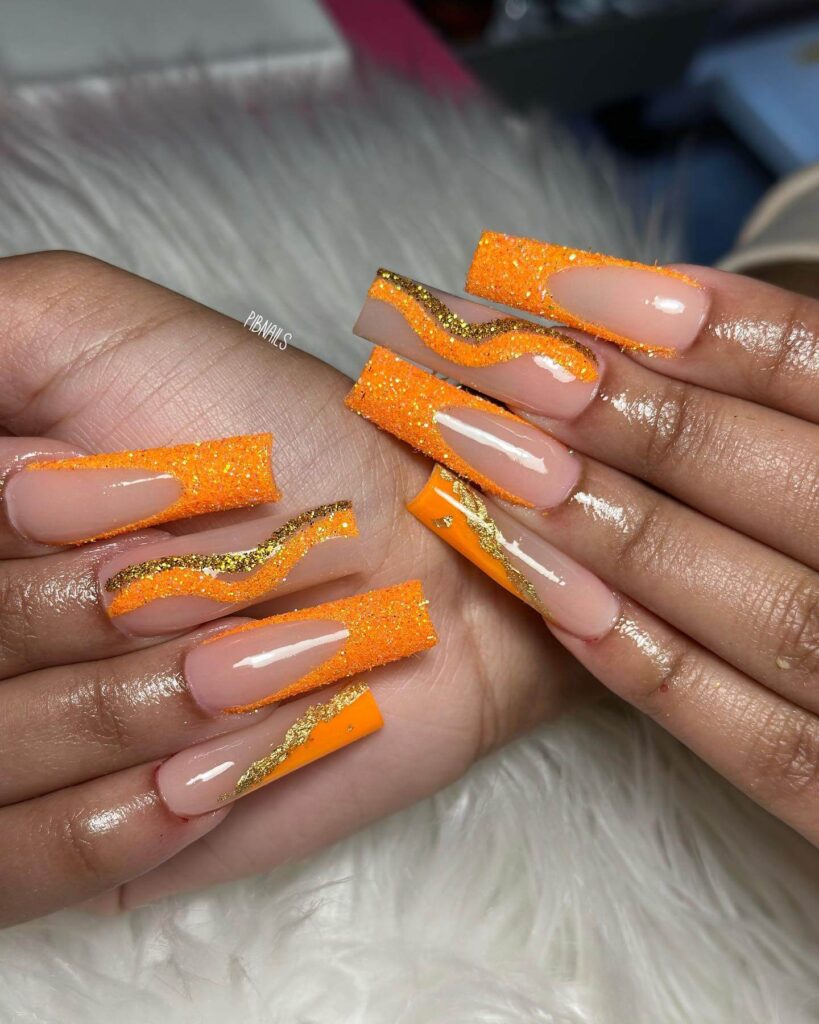 trendy summer nails with a range of orange shades including neon, burnt, and glitter finishes, ideal for seasonal flair.