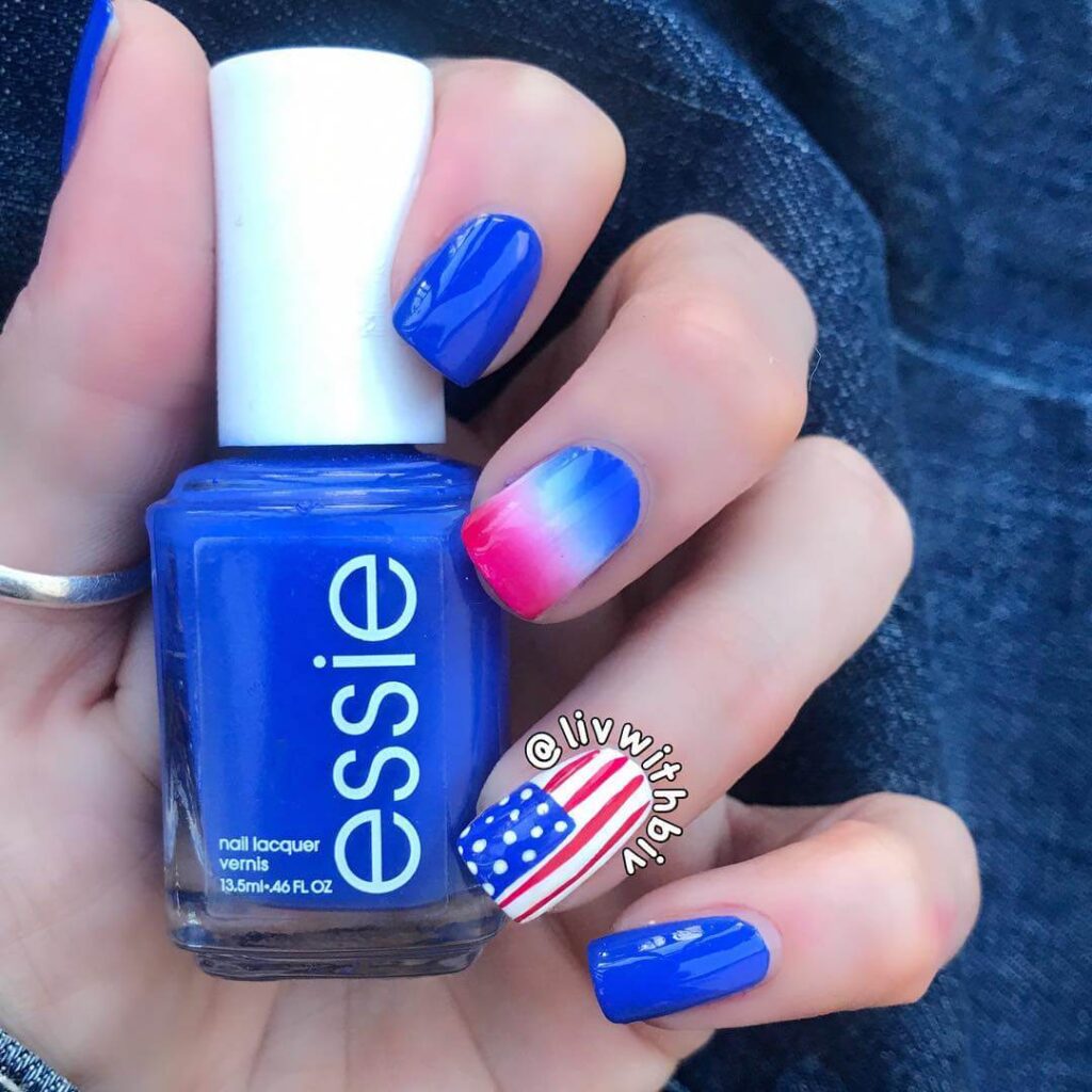 Colorful 4th of July nails featuring stars, stripes, and glitter in red, white, and blue.