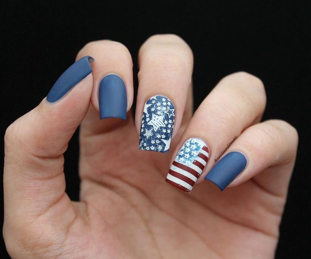 Colorful 4th of July nails featuring stars, stripes, and glitter in red, white, and blue.