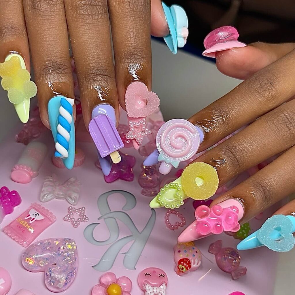 Close-up of candy nails featuring candy cane designs, lollipop nails, and candy corn nails with vibrant colors and intricate patterns.