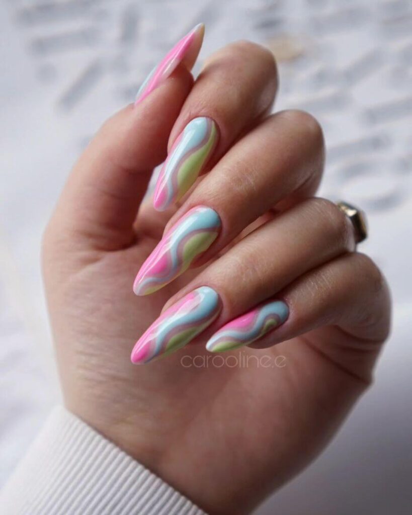 Close-up of candy nails featuring candy cane designs, lollipop nails, and candy corn nails with vibrant colors and intricate patterns.