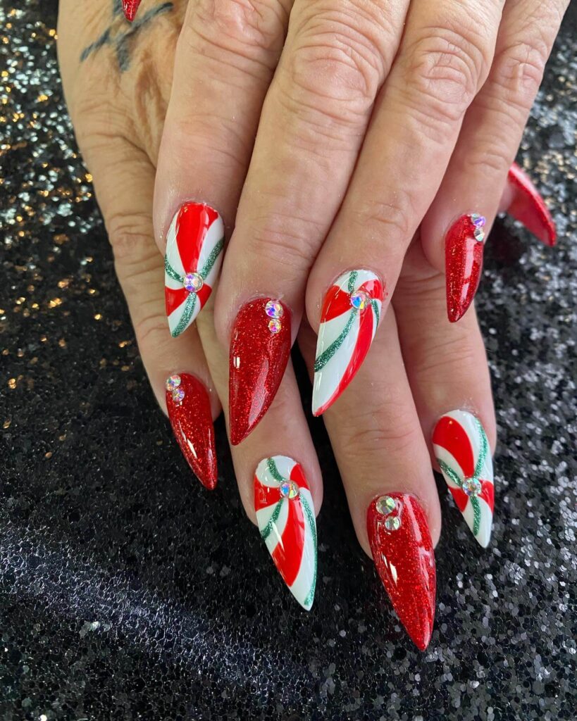 Close-up of candy nails featuring candy cane designs, lollipop nails, and candy corn nails with vibrant colors and intricate patterns.