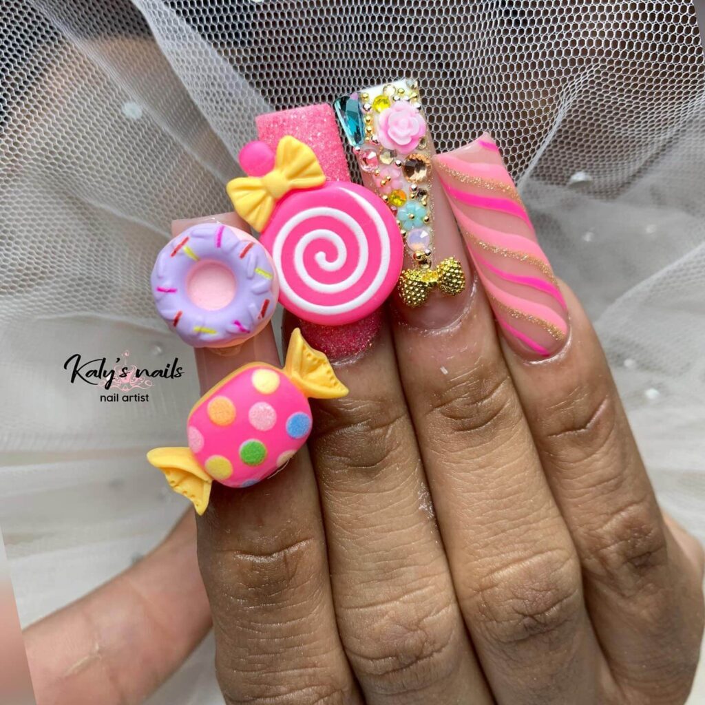 Close-up of candy nails featuring candy cane designs, lollipop nails, and candy corn nails with vibrant colors and intricate patterns.