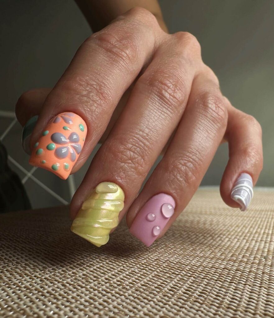 Close-up of candy nails featuring candy cane designs, lollipop nails, and candy corn nails with vibrant colors and intricate patterns.