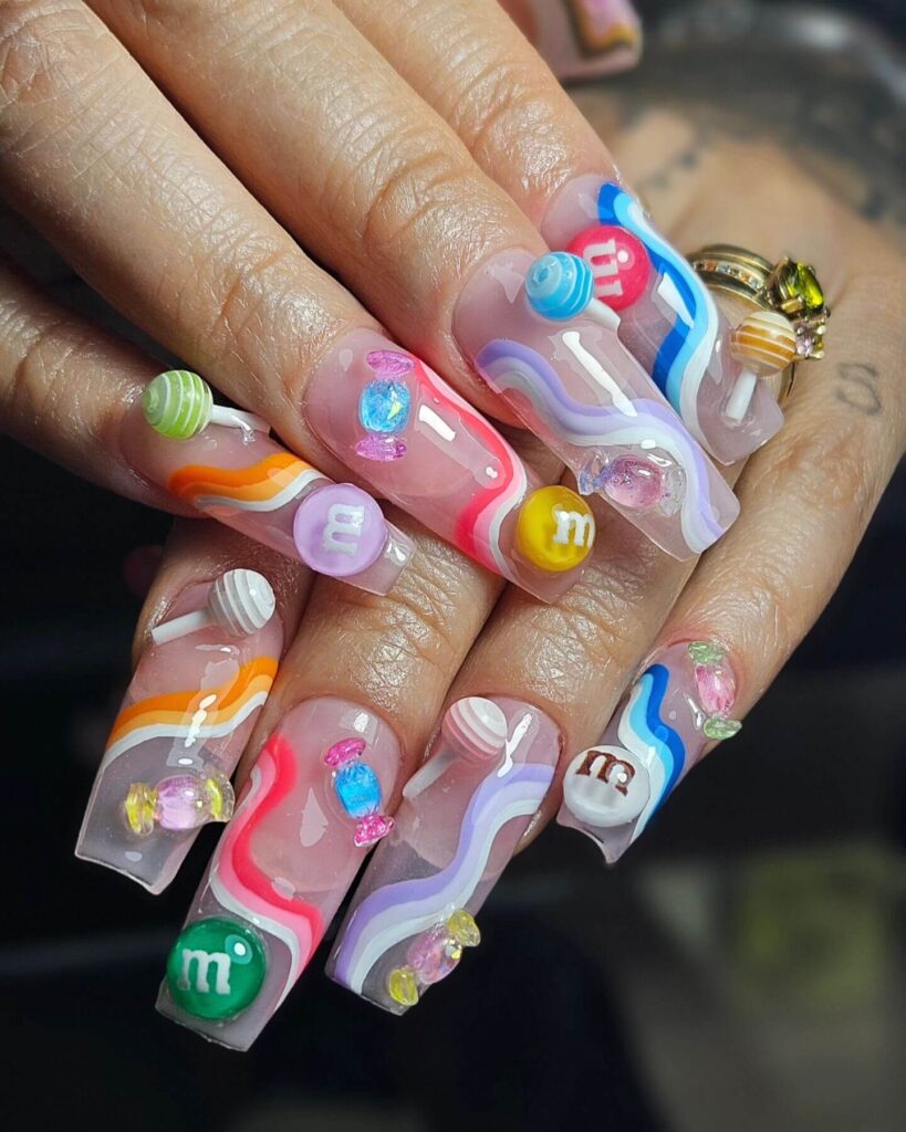 Close-up of candy nails featuring candy cane designs, lollipop nails, and candy corn nails with vibrant colors and intricate patterns.