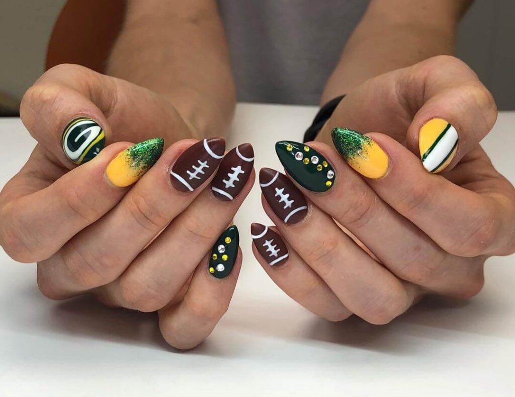 Variety of football nail designs including blue football nails, Celtic FC nails, and football acrylic nails with team logos.