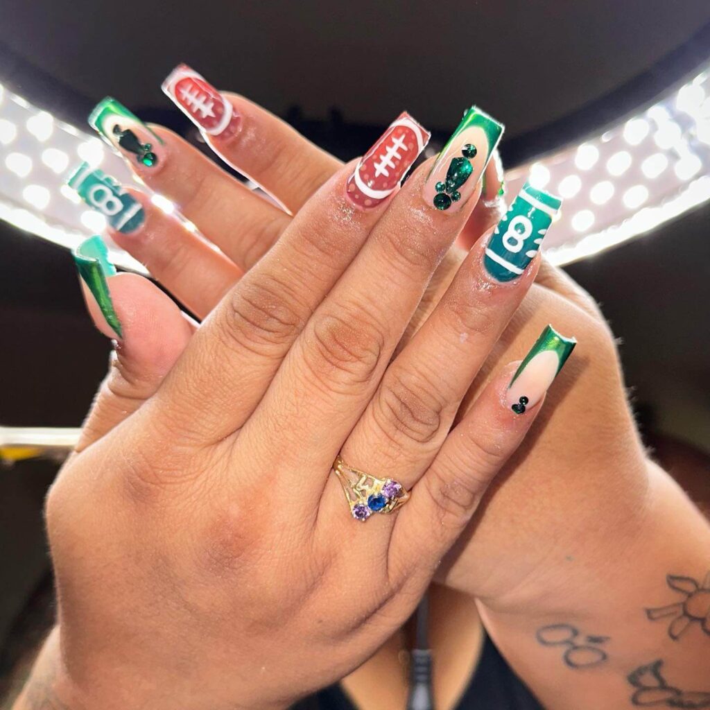 Variety of football nail designs including blue football nails, Celtic FC nails, and football acrylic nails with team logos.