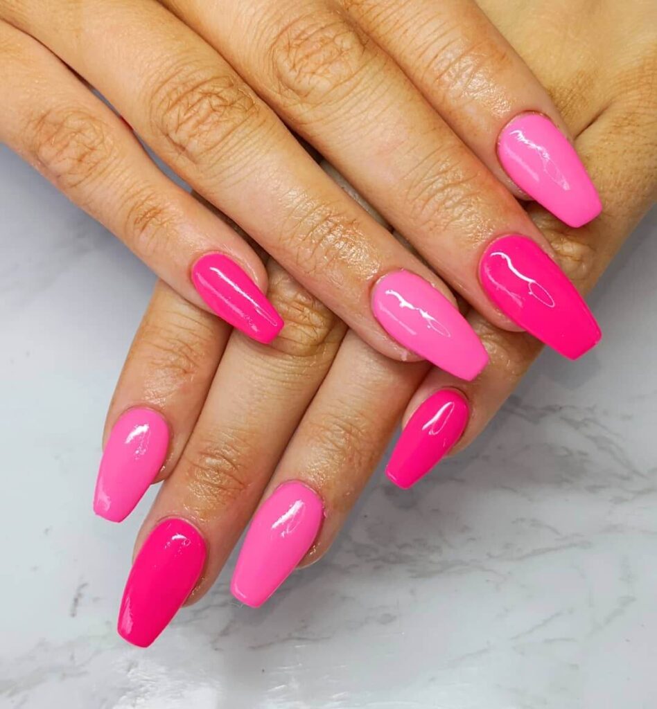 A variety of neon pink nails designs including neon pink and purple ombre nails, neon animal print nails, and neon matte nail designs.