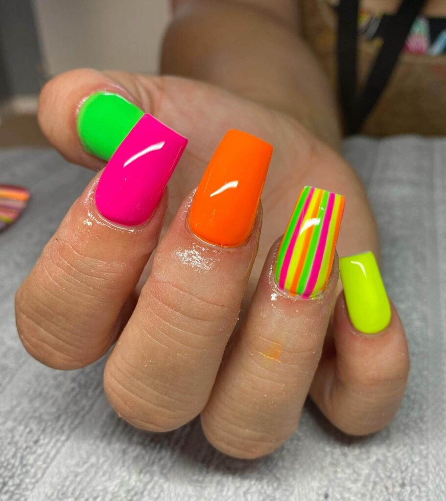 Bright and vibrant neon summer nails with trendy summer nail designs.