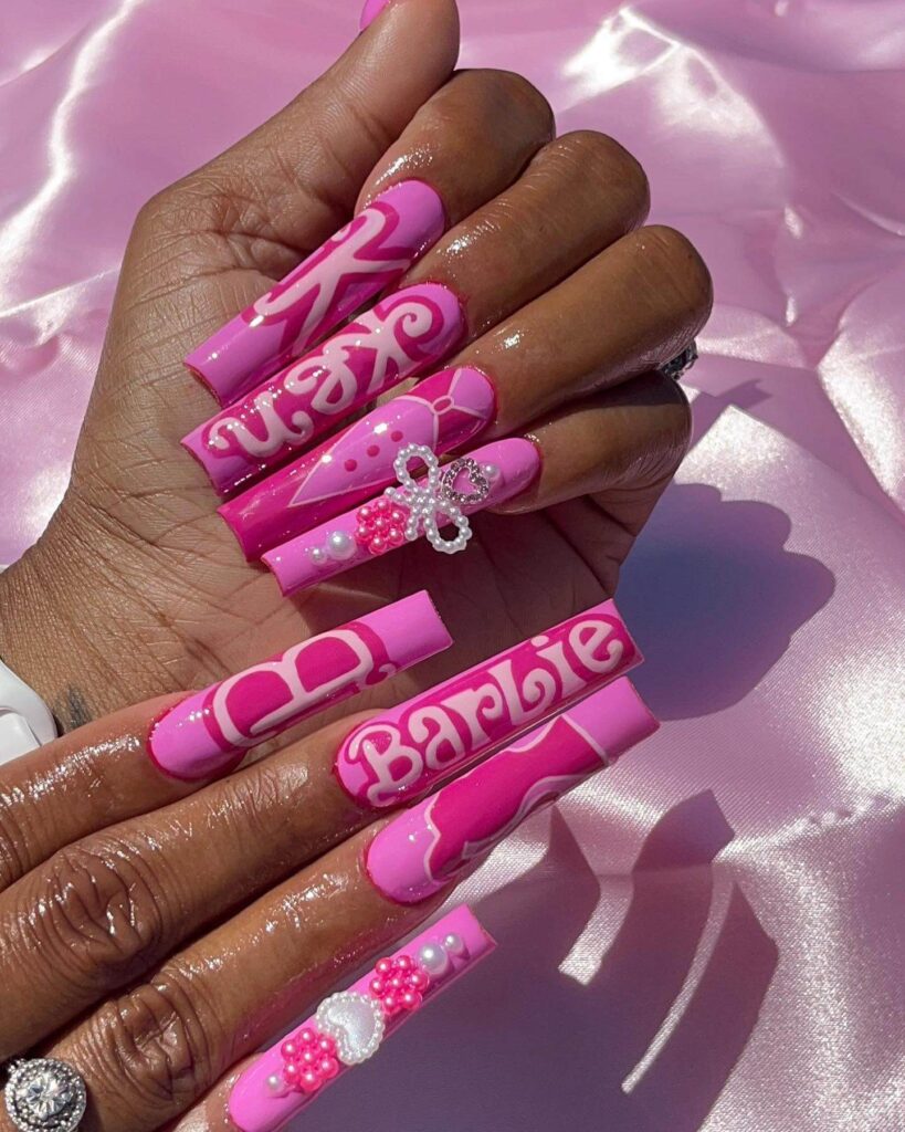 Various pink nail designs including bright pink nail designs, cute pink nail designs, and Christmas nails in pink with intricate patterns and decorations.