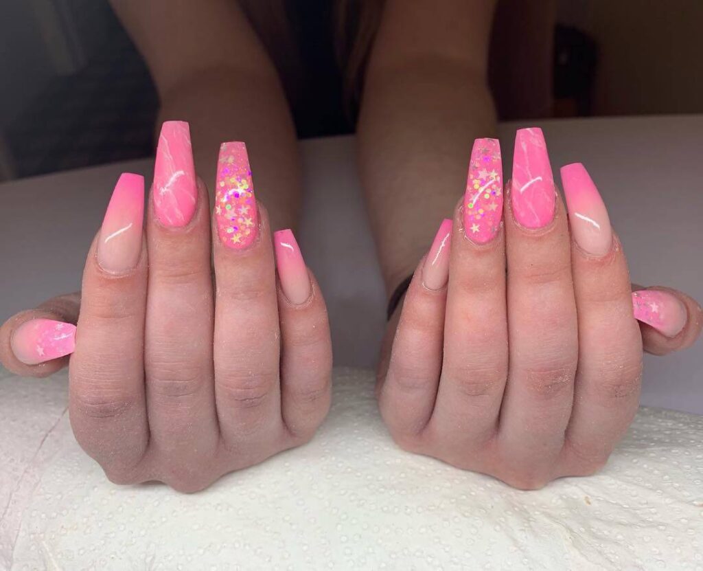 Various pink nail designs including bright pink nail designs, cute pink nail designs, and Christmas nails in pink with intricate patterns and decorations.