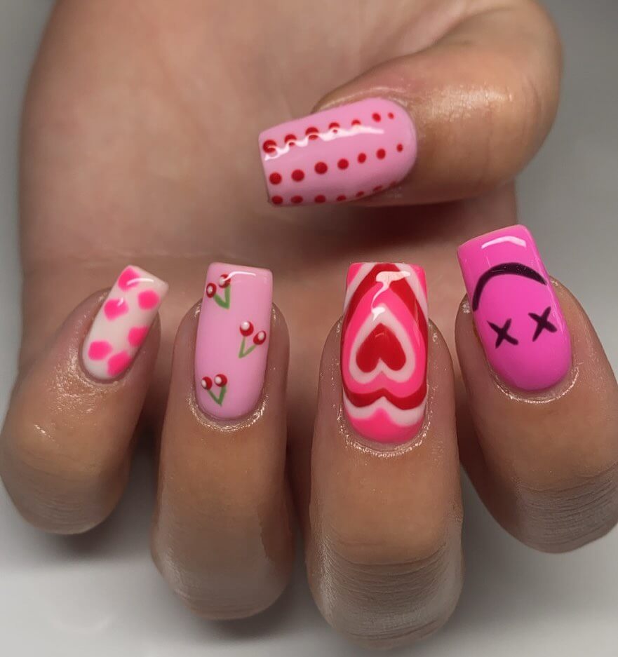 Various pink nail designs including bright pink nail designs, cute pink nail designs, and Christmas nails in pink with intricate patterns and decorations.