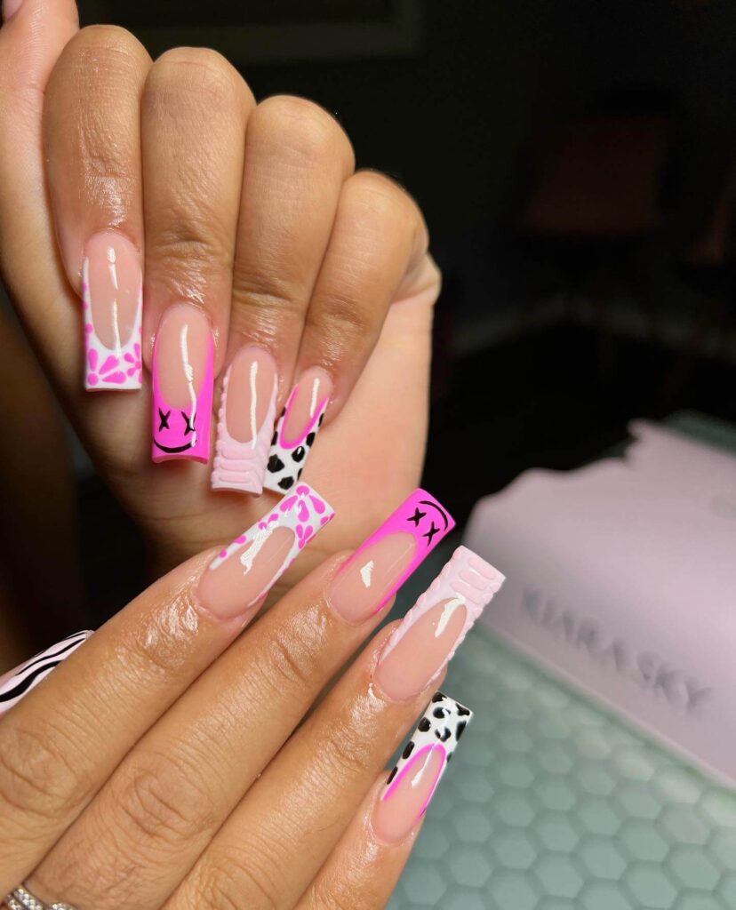 Various pink nail designs including bright pink nail designs, cute pink nail designs, and Christmas nails in pink with intricate patterns and decorations.