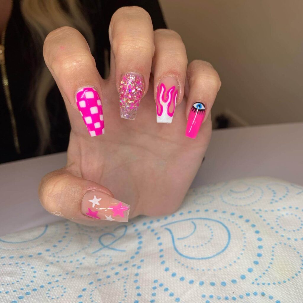 Various pink nail designs including bright pink nail designs, cute pink nail designs, and Christmas nails in pink with intricate patterns and decorations.