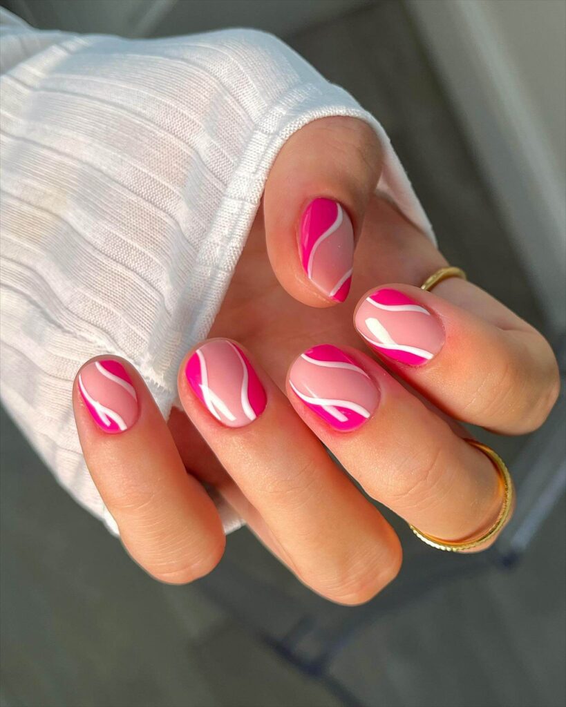 Various pink nail designs including bright pink nail designs, cute pink nail designs, and Christmas nails in pink with intricate patterns and decorations.