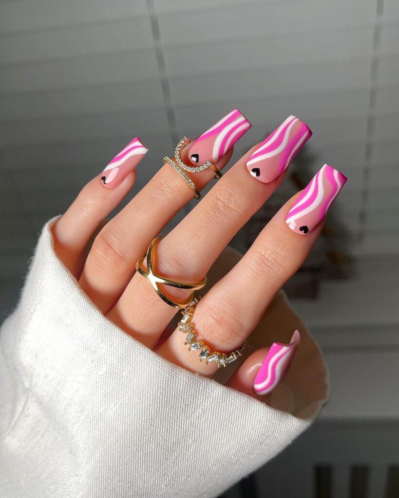 Various pink nail designs including bright pink nail designs, cute pink nail designs, and Christmas nails in pink with intricate patterns and decorations.