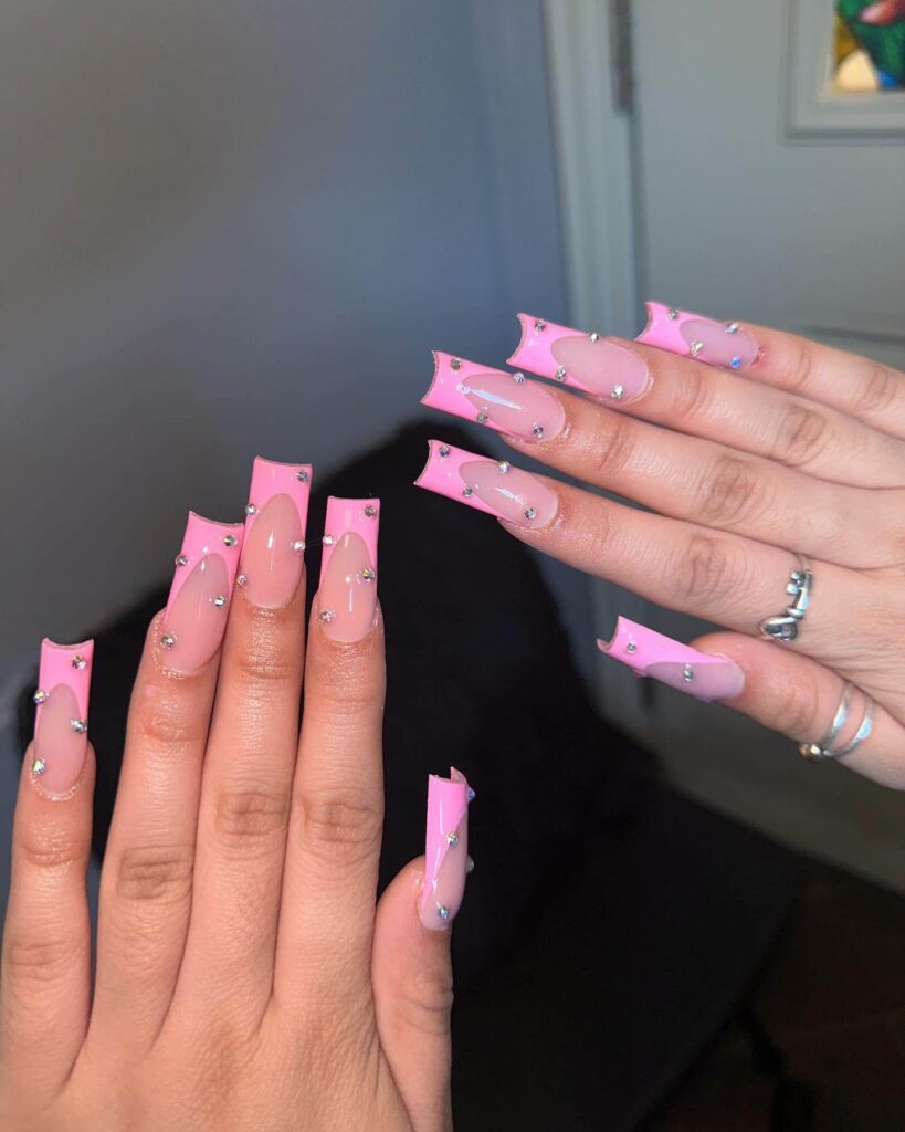 Various pink nail designs including bright pink nail designs, cute pink nail designs, and Christmas nails in pink with intricate patterns and decorations.