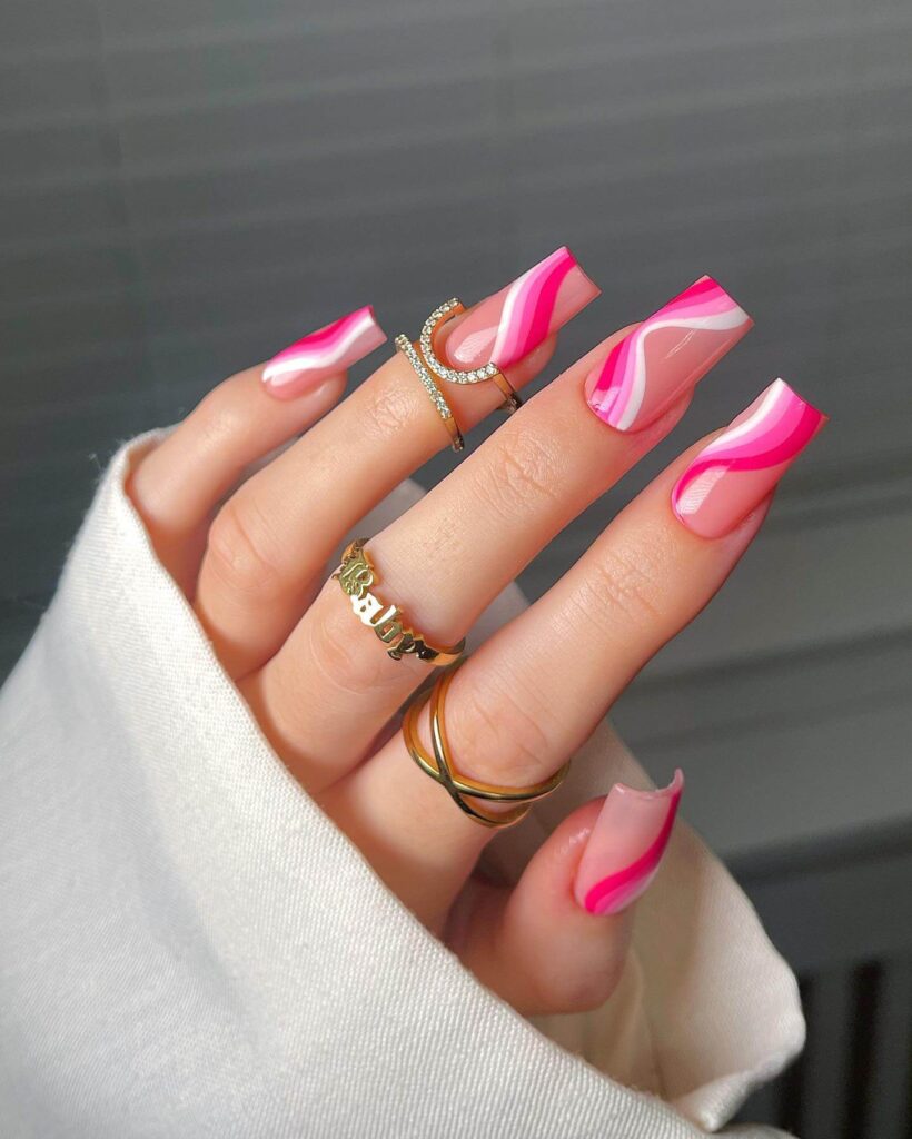 Various pink nail designs including bright pink nail designs, cute pink nail designs, and Christmas nails in pink with intricate patterns and decorations.