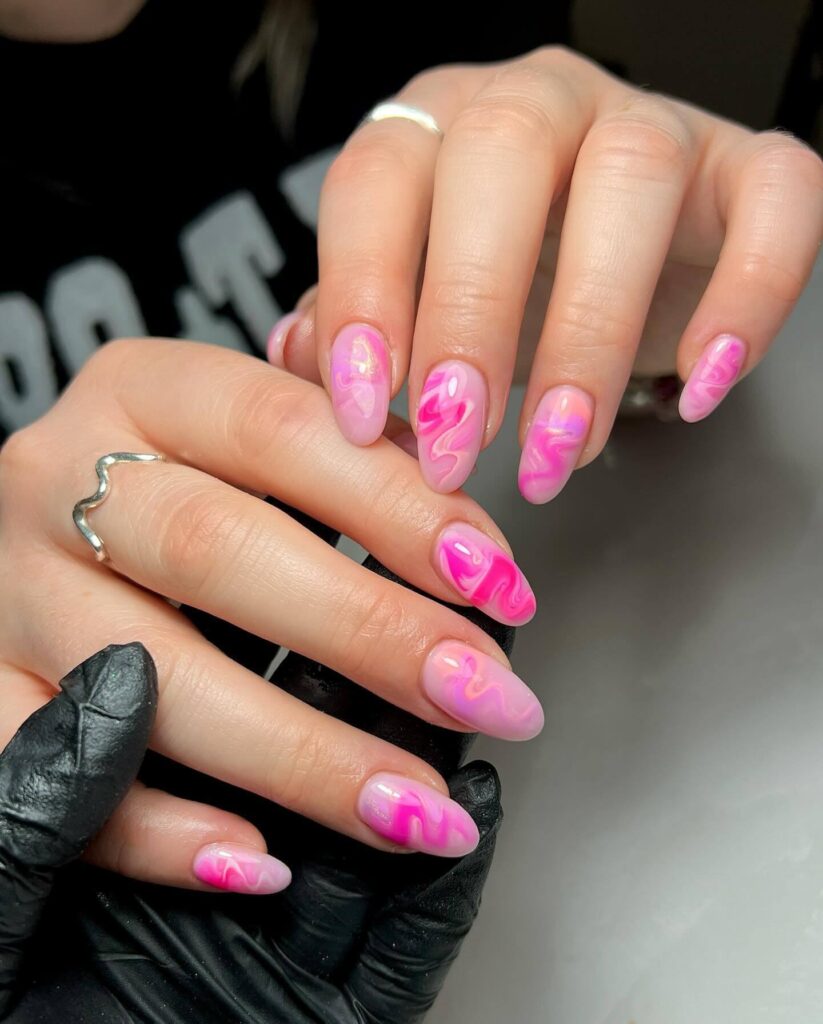 Various pink nail designs including bright pink nail designs, cute pink nail designs, and Christmas nails in pink with intricate patterns and decorations.