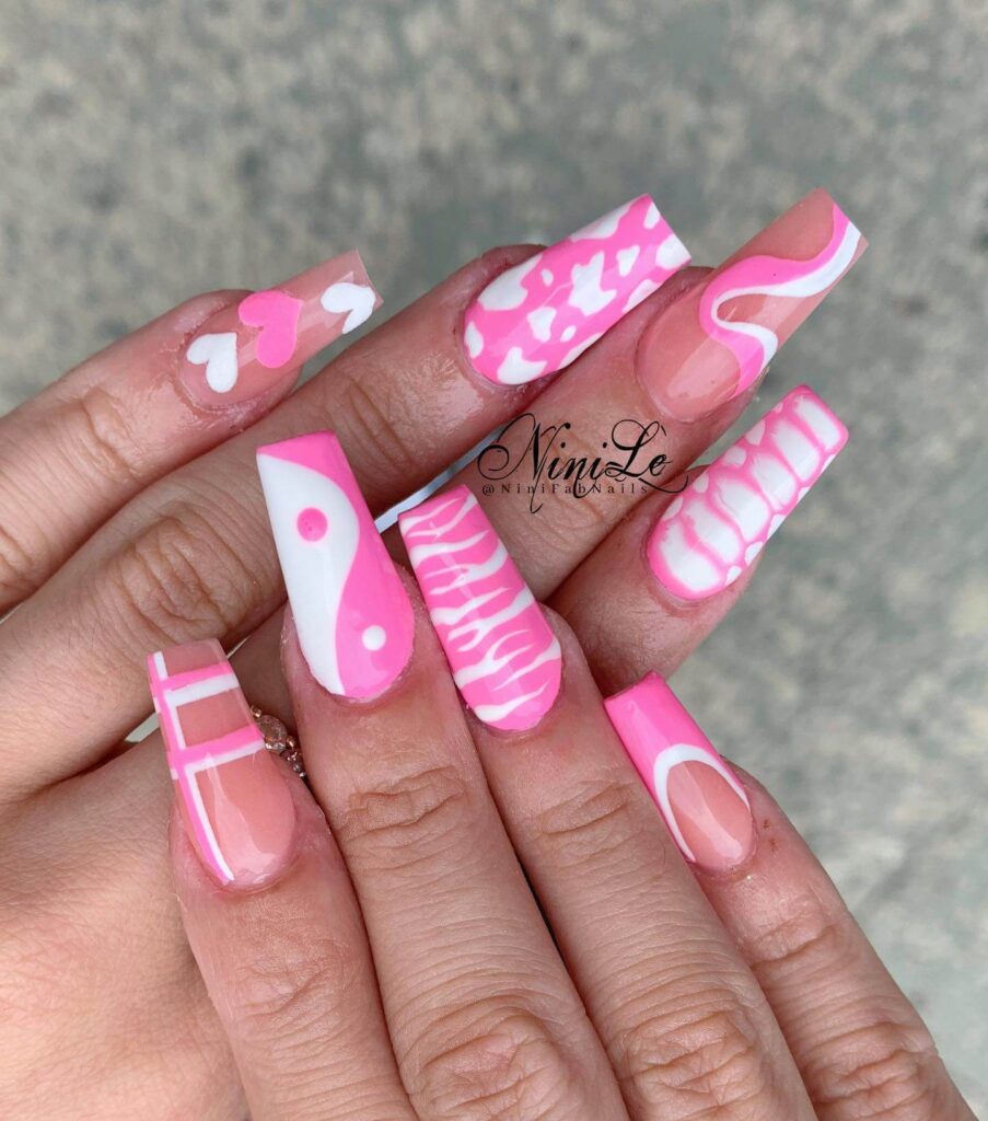 Various pink nail designs including bright pink nail designs, cute pink nail designs, and Christmas nails in pink with intricate patterns and decorations.