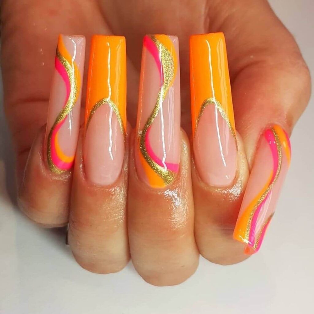 Bright and playful summer nail art with vibrant shades of blue, pink, and yellow, featuring beach-inspired designs and floral patterns.