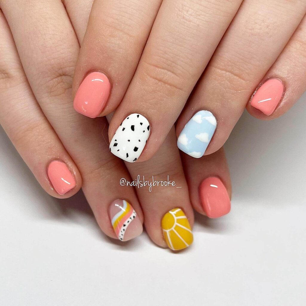 Array of summer nail designs showcasing bright colors and creative patterns on beautifully manicured nails.