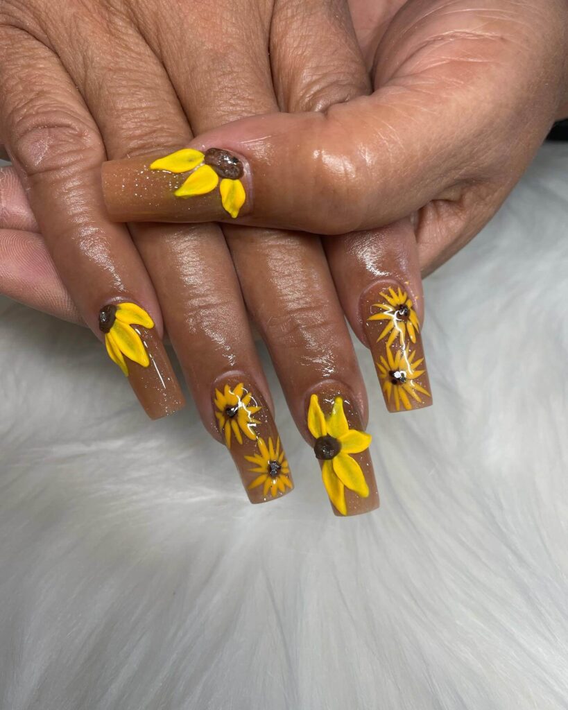 Elegant sunflower nails with intricate designs on both gel and matte finishes, perfect for any season.