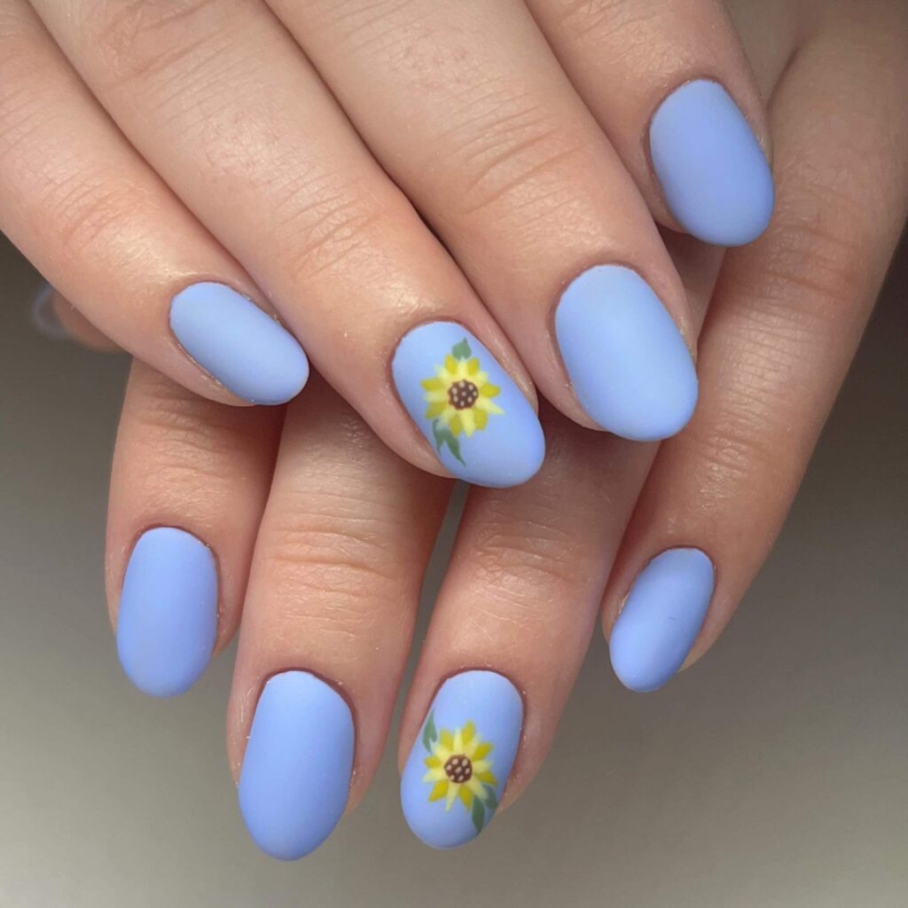 Elegant sunflower nails with intricate designs on both gel and matte finishes, perfect for any season.