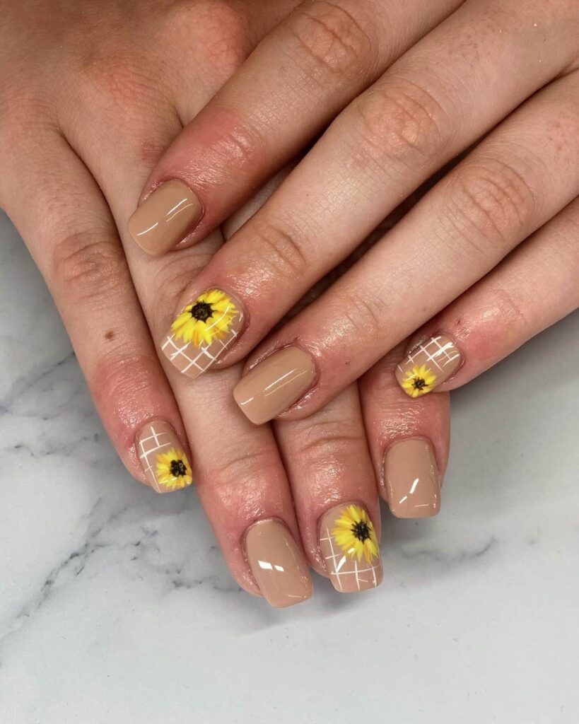 Elegant sunflower nails with intricate designs on both gel and matte finishes, perfect for any season.