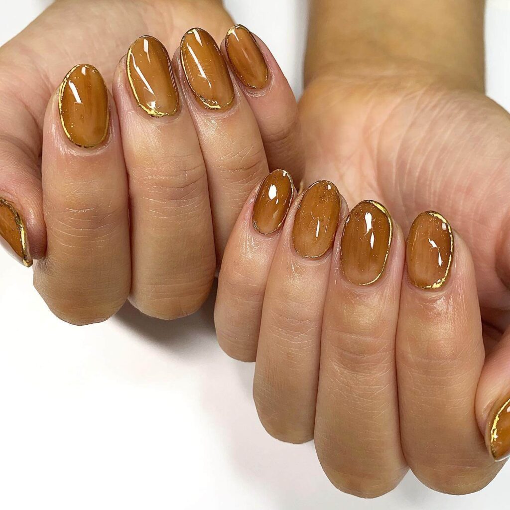 Explore the world of amber nails with creative amber nail art ideas, from amber gel nails to amber acrylic nails and more. Get inspired for your next manicure.