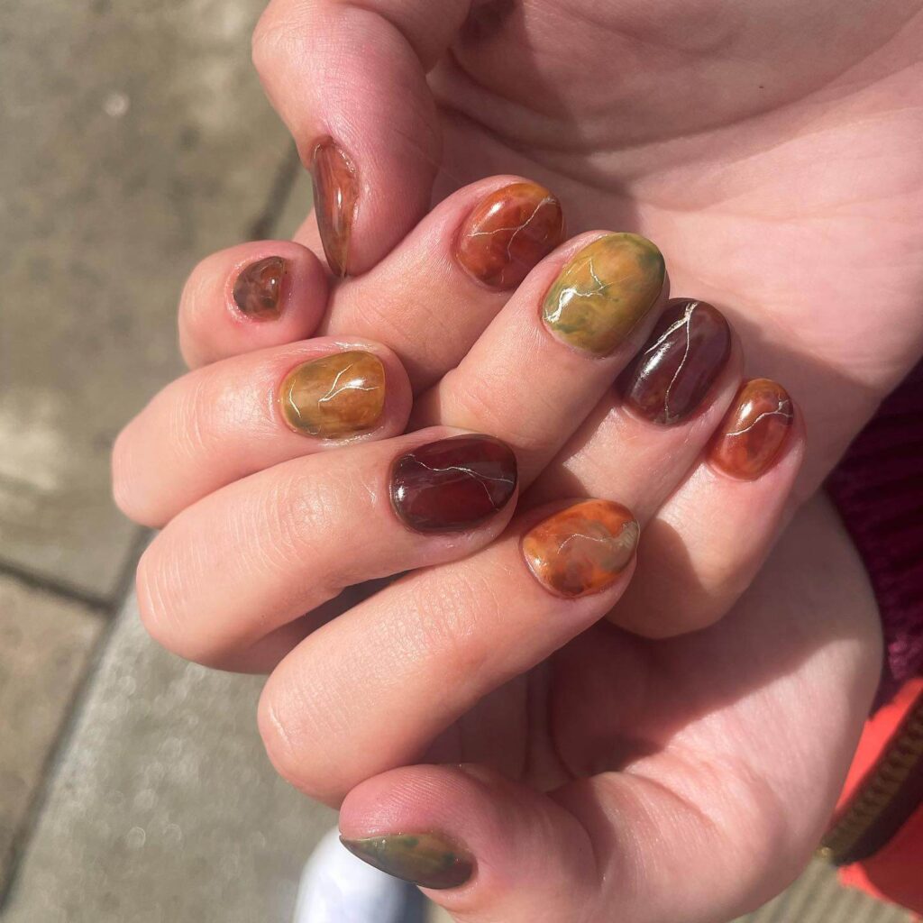 Explore the world of amber nails with creative amber nail art ideas, from amber gel nails to amber acrylic nails and more. Get inspired for your next manicure.