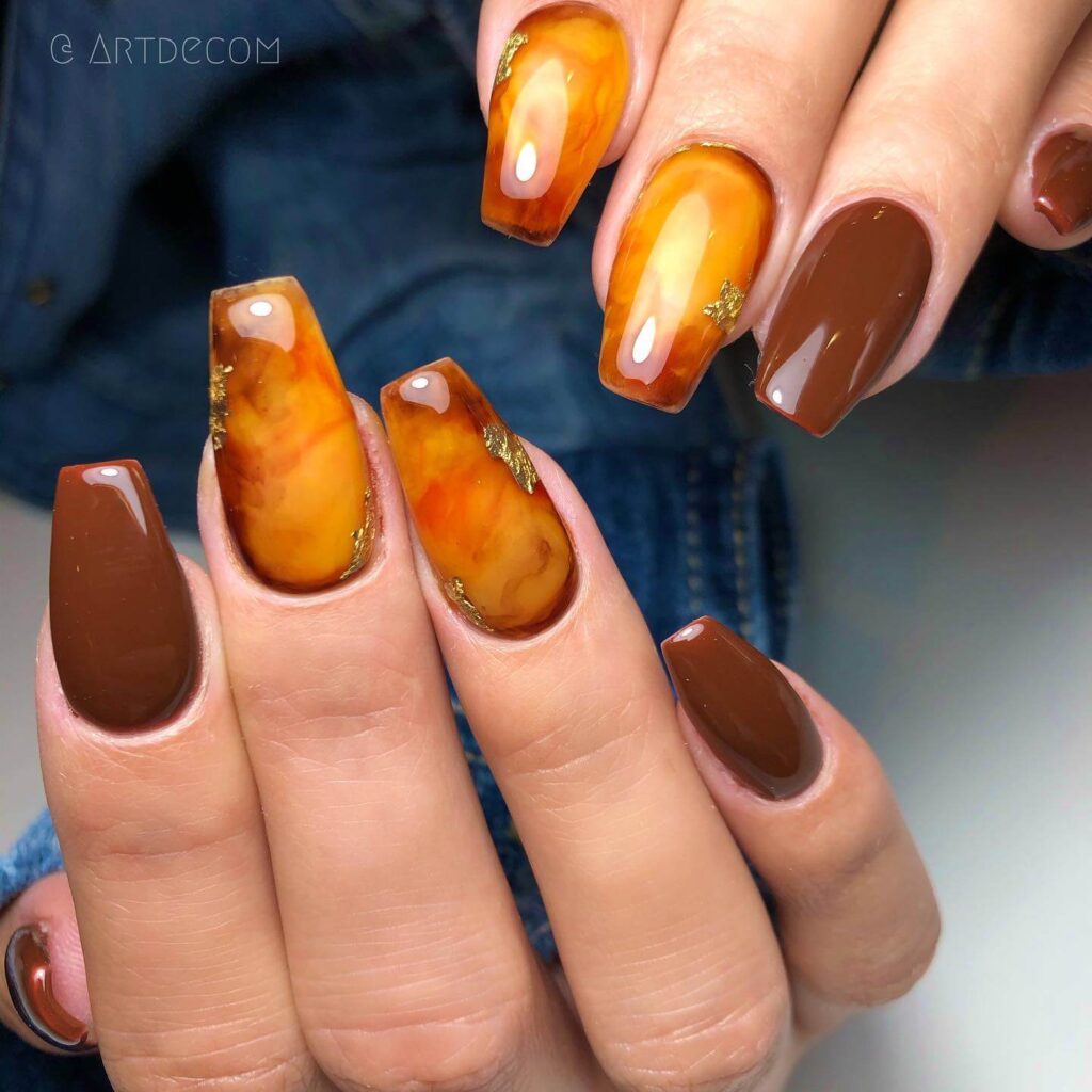 Explore the world of amber nails with creative amber nail art ideas, from amber gel nails to amber acrylic nails and more. Get inspired for your next manicure.