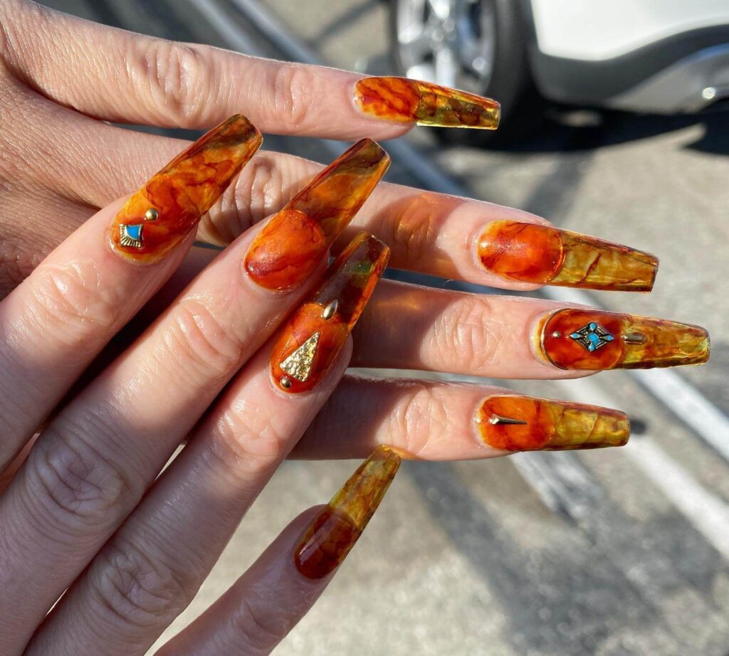 Explore the world of amber nails with creative amber nail art ideas, from amber gel nails to amber acrylic nails and more. Get inspired for your next manicure.