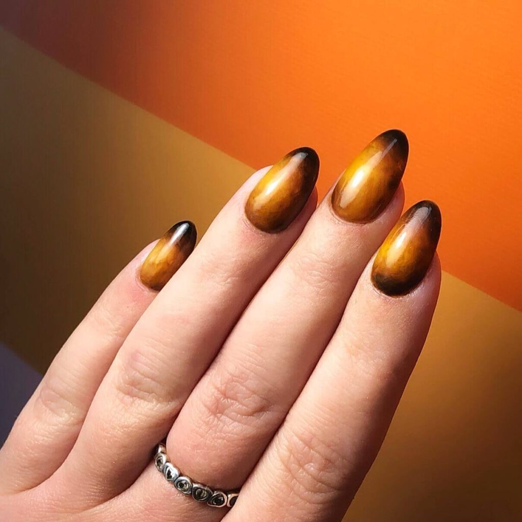 Explore the world of amber nails with creative amber nail art ideas, from amber gel nails to amber acrylic nails and more. Get inspired for your next manicure.