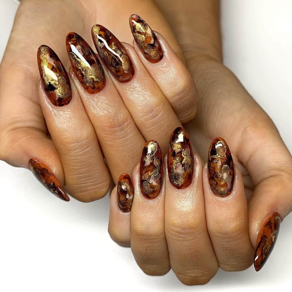 Explore the world of amber nails with creative amber nail art ideas, from amber gel nails to amber acrylic nails and more. Get inspired for your next manicure.