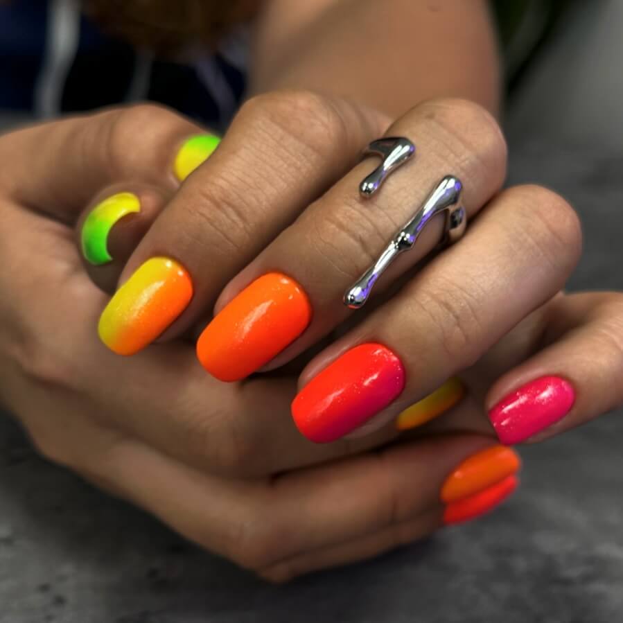 A variety of gradient nails designs including fall gradient nails, black to red gradient nails, and blue glitter fade nails.