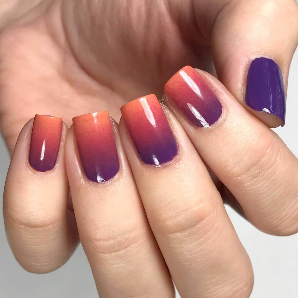 A variety of gradient nails designs including fall gradient nails, black to red gradient nails, and blue glitter fade nails.