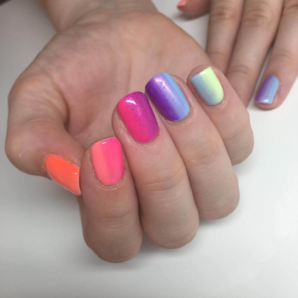 A variety of gradient nails designs including fall gradient nails, black to red gradient nails, and blue glitter fade nails.